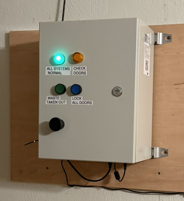 Real home control panel with three buttons and two lights